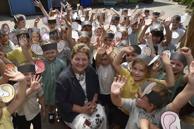 William Law C of E primary school head teacher Tracey Cunningham with reception children at her retiring event at school. EMN-210722-093043009