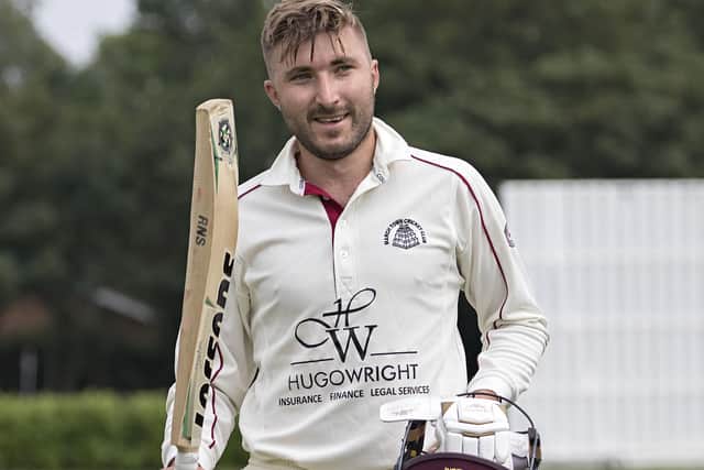 Brandon Phillips celebrates a ton for March Town against St Ives & Warboys. Photo: Pat Ringham.