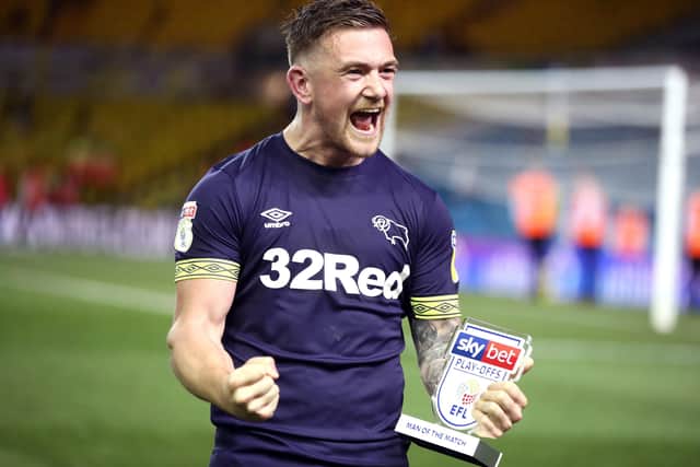 Jack Marriott celebrates with the man-of-the-match award after Derby beat Leeds United in a 2019 Championship play-off semi-final at Elland Road. Marriott scored twice.