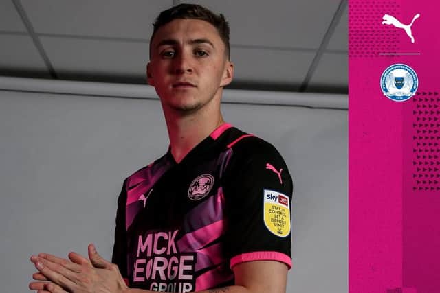 Posh midfielder Jack Taylor wearing the club's 2021-22 away shirt.