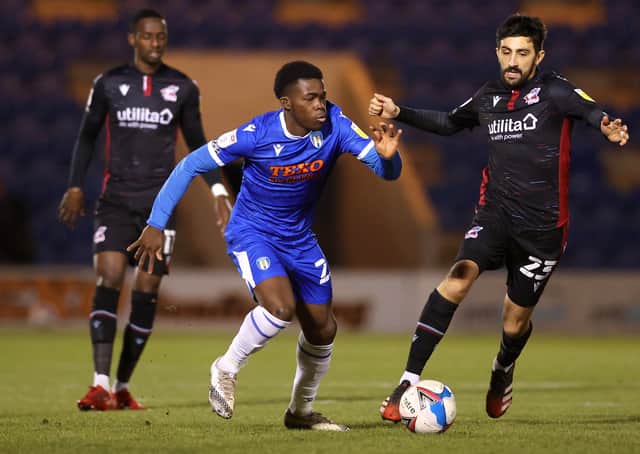 Kwame Poku (blue) in action for Colchester.  Photo: James Chance/Getty Images.