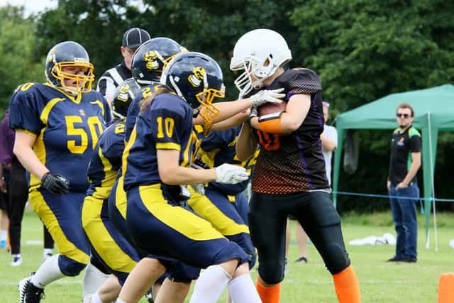 Izzy Gibbs of Peterborough Royals is surrounded. Photo: Mick Sutterby.