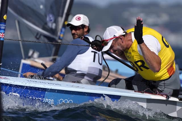 Great Britain's Giles Scott celebrates his Gold after the Men’s Finn medal race during the Sailing at Enoshima on the eleventh day of the Tokyo 2020 Olympic Games in Japan. PA Wire/PA Images