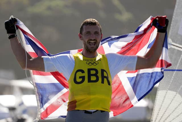 Great Britain's Giles Scott celebrates his Gold after the Men’s Finn medal race during the Sailing at Enoshima on the eleventh day of the Tokyo 2020 Olympic Games in Japan. PA Wire/PA Images