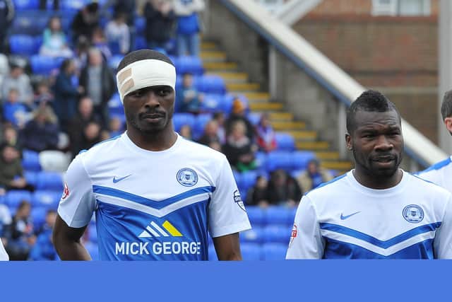 Gaby Zakuani (left) with Aaron Mclean.