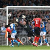 Christy Pym of Peterborough United cant prevent Luton Town from scoring the opening goal of the game. Photo: Joe Dent/theposh.com.
