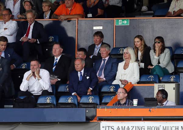 Co-owner Darragh MacAnthony (front row left) watching Posh at Luton. Photo: Joe Dent/theposh.com.