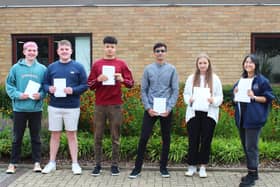 Pupils at Jack Hunt school collect their results.