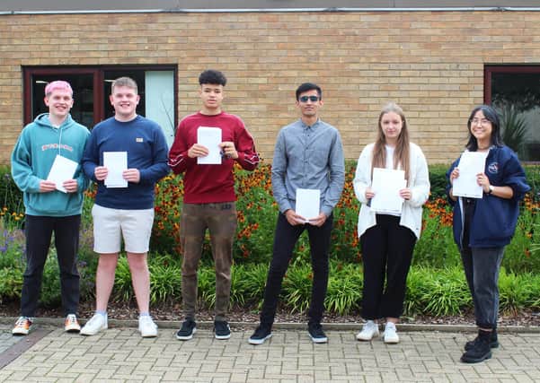 Pupils at Jack Hunt school collect their results.