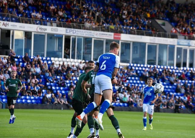 Frankie Kent wins an aerial challenge for Posh against Plymouth. Photo: David Lowndes.