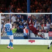 Posh goalkeeper Dai Cornell makes a flying save in the game against Plymouth. Photo: Joe Dent/theposh.com.