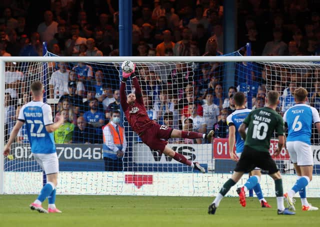 Posh goalkeeper Dai Cornell makes a flying save in the game against Plymouth. Photo: Joe Dent/theposh.com.