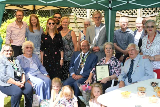 Marion's friends and family celebrate her civic award.