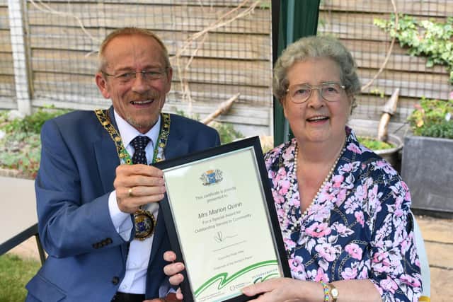 Mayor of Peterborough Stephen Lane presents a Civic Award to  Marion Quinn (78) following her 17 years of service volunteering at the Netherton Friendship Club.