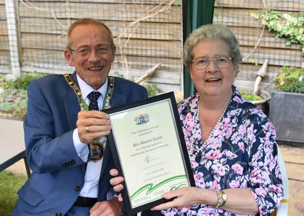 Mayor of Peterborough Stephen Lane presents a Civic Award to  Marion Quinn (78) following her 17 years of service volunteering at the Netherton Friendship Club.
