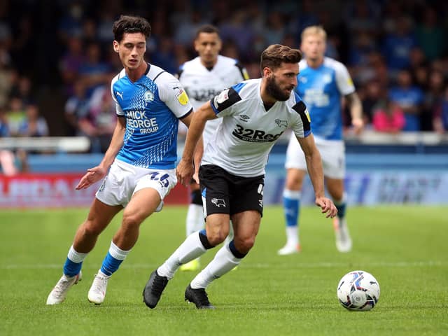 Joel Randall of Peterborough United in action with Graeme Shinnie of Derby County. Photo: Joe Dent/theposh.com