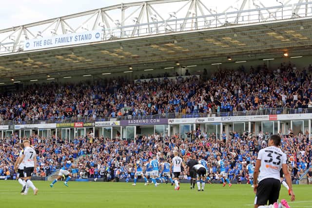 Peterborough United supporters celebrate the equalising goal against Derby. Photo: Joe Dent/theposh.com.
