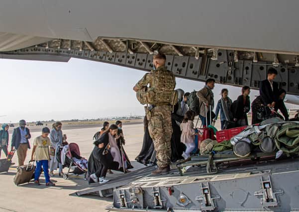 Ministry of Defence photo of British citizens and dual nationals residing in Afghanistan getting on a RAF plane before being relocated to the UK. British troops are racing against the clock to get remaining UK nationals and their local allies out of Afghanistan following the dramatic fall of the country's Western-backed government to the Taliban.Picture: PA Media