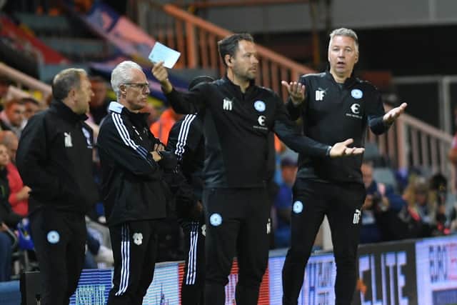 Posh boss Darren Ferguson and goalkeeping coach Mark Tyler during the game against Cardiff. Photo: David Lowndes.