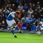 Posh striker Jonson Clarke-Harris shoots at the Cardiff goal. Photo: David Lowndes.