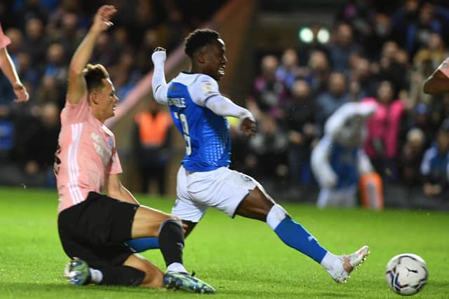 Siriki Dembele scores for Posh against Cardiff. Photo: David Lowndes.