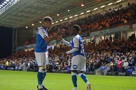 Siriki Dembele of Peterborough United celebrates his goal against Cardiff with Jonson Clarke-Harris. Photo: Joe Dent/theposh.com.