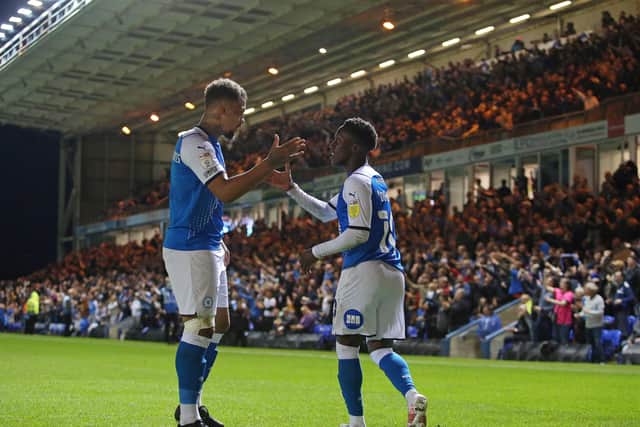 Siriki Dembele of Peterborough United celebrates his goal against Cardiff with Jonson Clarke-Harris. Photo: Joe Dent/theposh.com.