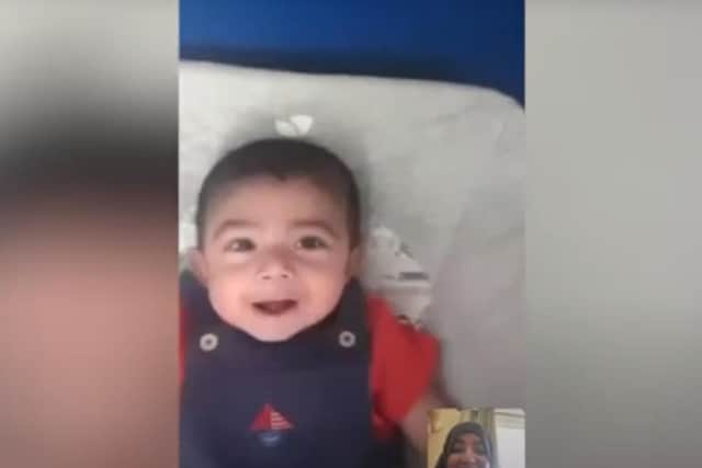 Hajrah speaks to her son Huzayfah via videochat.