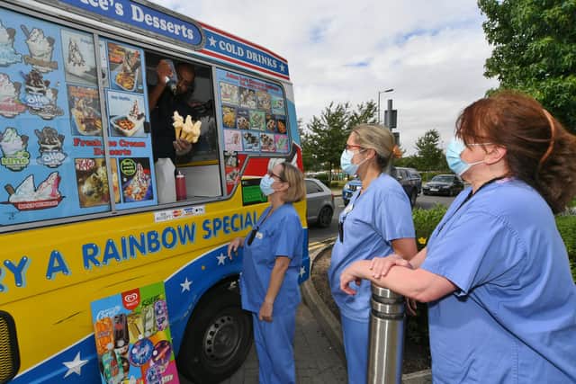 Hospital staff queue up for their free ice cream.