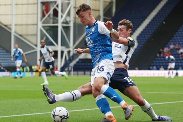 Harrison Burrows of Peterborough United in action with Ryan Ledson of Preston North End. Photo: Joe Dent/theposh.com.