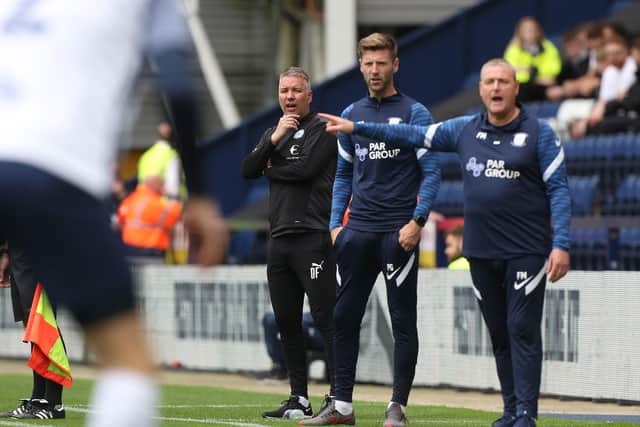 Peterborough United Manager Darren Ferguson watches on from the touchline alongside Preston North End manager Frankie McAvoy. Photo: Joe Dent/theposh.com.