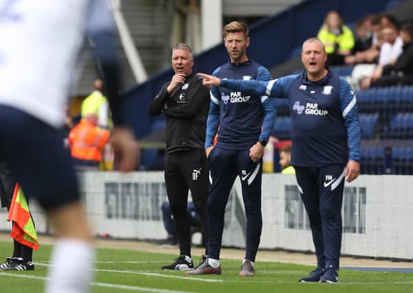 Peterborough United Manager Darren Ferguson watches on from the touchline alongside Preston North End manager Frankie McAvoy. Photo: Joe Dent/theposh.com