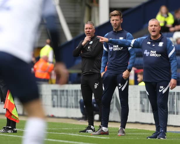 Peterborough United Manager Darren Ferguson watches on from the touchline alongside Preston North End manager Frankie McAvoy. Photo: Joe Dent/theposh.com
