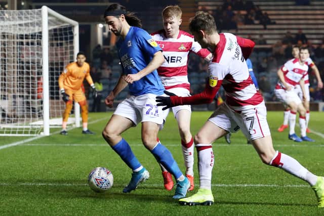 Kieran Sadlier (right) with George Boyd during a Posh v Doncaster match.