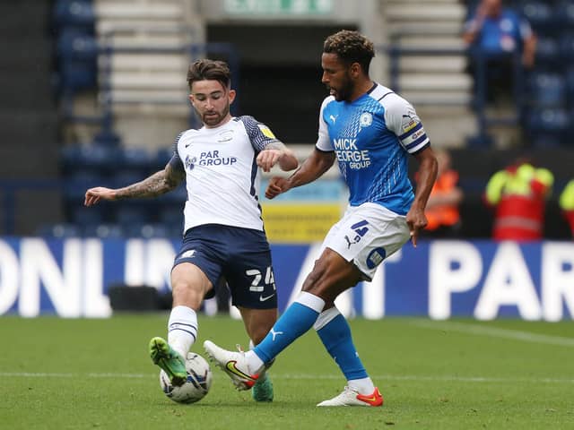 Nathan Thompson Peterborough United in action with Sean Maguire of Preston North End. Photo: Joe Dent/theposh.com.