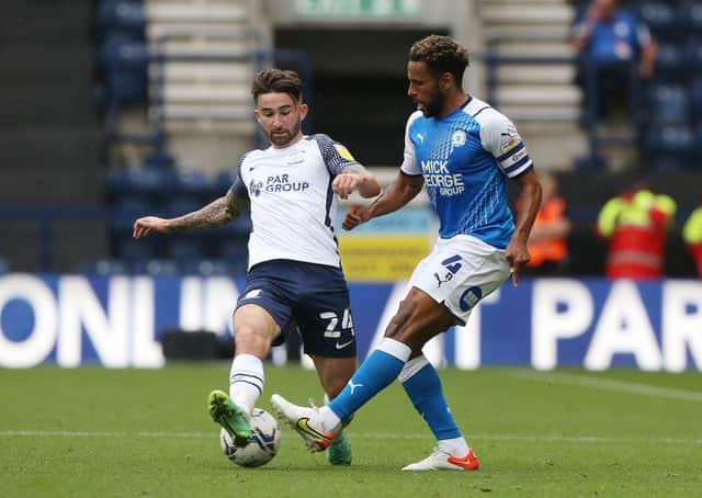 Nathan Thompson Peterborough United in action with Sean Maguire of Preston North End. Photo: Joe Dent/theposh.com.