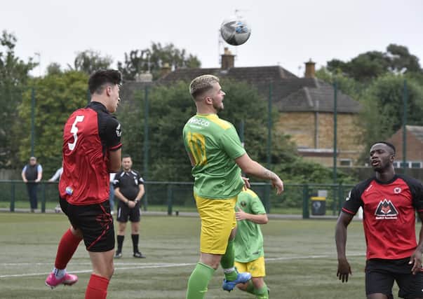 Action from Netherton United 1, Oakham United 1. Netherton are in red shirts. Photo: David Lowndes.