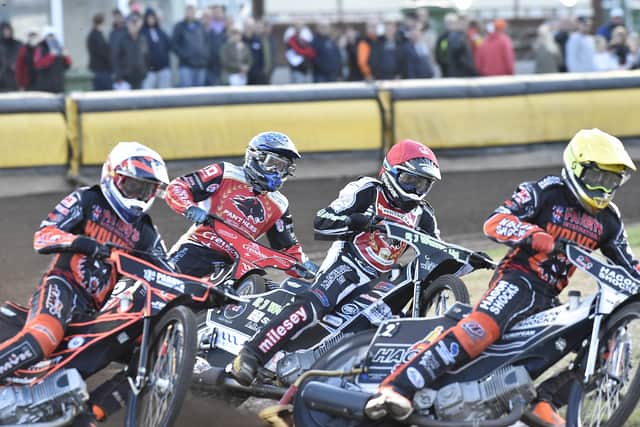 Action from heat one of Panthers v Wolverhampton. Panthers men are Danny King (red helmet) and Bjarne Pedersen (blue). Photo: David Lowndes.