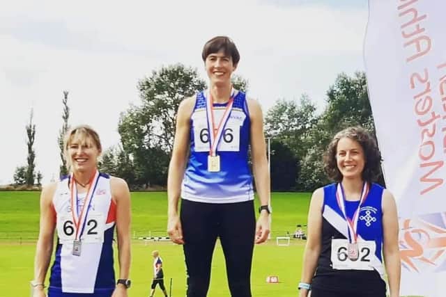 Claire Smith on top of the podium at the British Masters Championships.