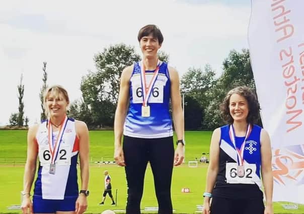Claire Smith on top of the podium at the British Masters Championships.