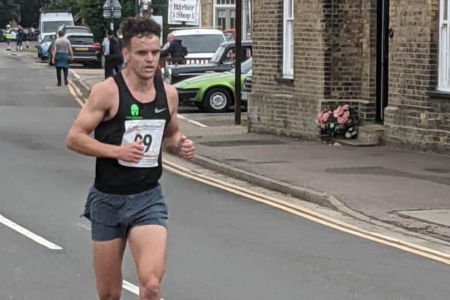Adam Peacock winning the Thorney five mile race.