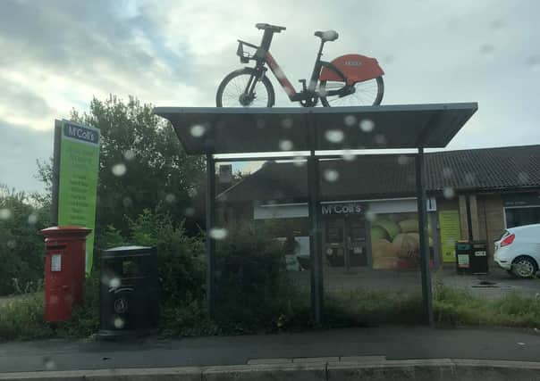 The e-bike on top of a bus stop on Gunthorpe Road. Photo: Dan Johnson-Morris.