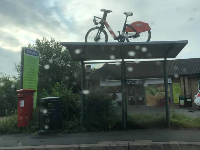 The e-bike on top of a bus stop on Gunthorpe Road. Photo: Dan Johnson-Morris.