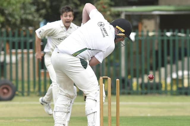 Newborough batsman Greg Rowland is bowled by Aaron Magee of Whittlesey. Photo: David Lowndes.