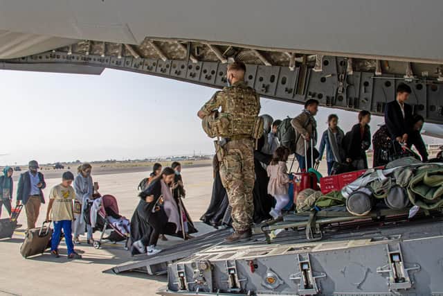 Ministry of Defence photo of British citizens and dual nationals residing in Afghanistan getting on a RAF plane before being relocated to the UK. British troops are racing against the clock to get remaining UK nationals and their local allies out of Afghanistan following the dramatic fall of the country's Western-backed government to the Taliban.Picture: PA Media