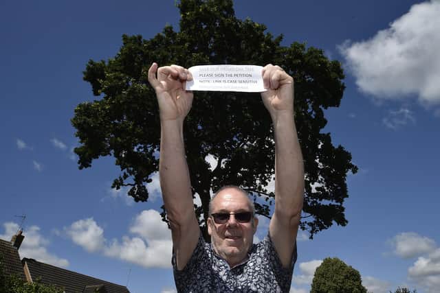 Campaigner Richard Elmer infront of the tree in Ringwood he is fighting to protect.
