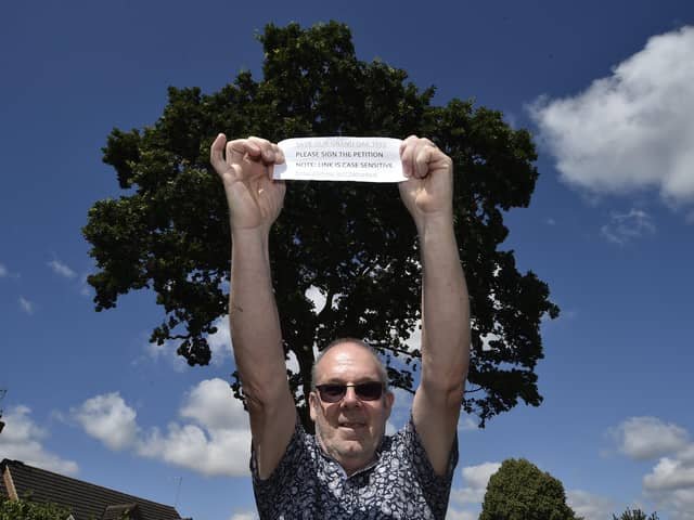 Richard Elmer infront of the tree in Ringwood he is fighting to protect.
