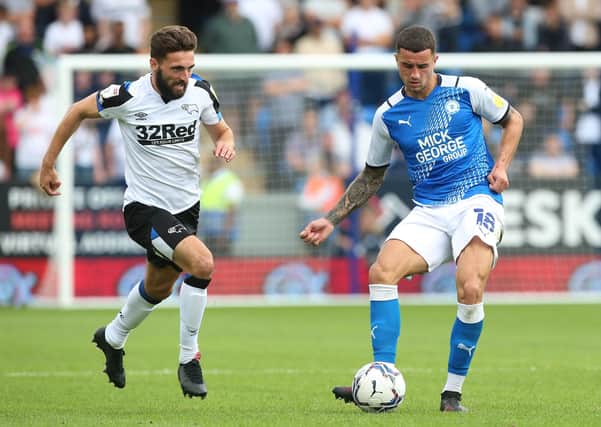 Oliver Norburn (right) in action for Posh against Derby. Photo: Joe Dent/theposh.com.
