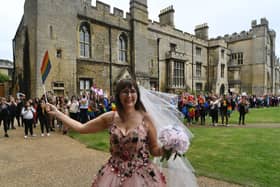 Cassandra Breed is cheered into the cathedral by Pride marchers before her wedding to husband Daniel: Pictures: David Lowndes