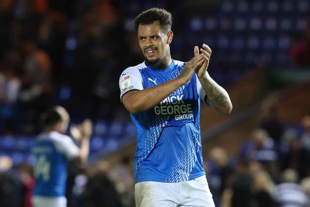 Posh striker Jonson Clarke-Harris applauds the fans at full-time. Photo: Joe Dent/theposh.com.